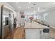Beautiful kitchen features spacious island with barstools and stainless steel appliances at 2281 Canyon Breeze Ave, Kissimmee, FL 34746