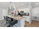 Modern kitchen with granite countertops, stainless steel appliances and island with breakfast bar at 2281 Canyon Breeze Ave, Kissimmee, FL 34746
