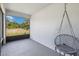 Relaxing screened lanai with a hanging chair and views of the serene surroundings, perfect for unwinding at 2281 Canyon Breeze Ave, Kissimmee, FL 34746