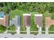 Aerial view showing roof and lot lines of homes in a well-maintained and landscaped neighborhood at 2398 Queenswood Cir, Kissimmee, FL 34743