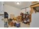Unfinished basement storage area with packed boxes and household items on shelves at 2398 Queenswood Cir, Kissimmee, FL 34743