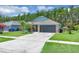 Charming single-Gathering home with well-maintained landscaping, a spacious driveway, and a two-car garage at 2398 Queenswood Cir, Kissimmee, FL 34743