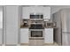 Modern kitchen featuring stainless steel appliances, ample cabinetry, and granite countertops at 2398 Queenswood Cir, Kissimmee, FL 34743