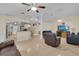 Spacious living area featuring an open floorplan, neutral paint, and tile floors at 2398 Queenswood Cir, Kissimmee, FL 34743