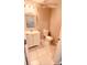 Cozy bathroom featuring a vanity, toilet, tile flooring and decorative lighting at 242 Abbotsbury Dr, Kissimmee, FL 34758