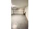 Spacious, two car garage with white walls, automatic door opener, and smooth concrete floors at 242 Abbotsbury Dr, Kissimmee, FL 34758