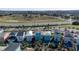 Aerial view of colorful homes with private pools, landscaping, and major road nearby, offering a serene suburban lifestyle at 2938 Salted Rim Rd, Kissimmee, FL 34747