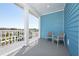 Balcony featuring a sitting area with a bright blue accent wall and a scenic view at 2938 Salted Rim Rd, Kissimmee, FL 34747
