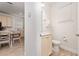 Tastefully designed half-bathroom featuring a vanity and a toilet with a neutral color palette at 2938 Salted Rim Rd, Kissimmee, FL 34747