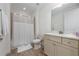 Bright bathroom featuring a shower, vanity, and toilet at 2938 Salted Rim Rd, Kissimmee, FL 34747