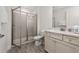 Well-lit bathroom showcasing a glass-door shower, a vanity with double sinks at 2938 Salted Rim Rd, Kissimmee, FL 34747