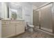 Bright bathroom with a walk-in shower, vanity, and toilet at 2938 Salted Rim Rd, Kissimmee, FL 34747