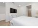 Bright bedroom with wood floors, a mounted television, and neutral decor at 2938 Salted Rim Rd, Kissimmee, FL 34747