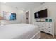 Bedroom featuring a large television, wood look floors, and an airy, open feel at 2938 Salted Rim Rd, Kissimmee, FL 34747