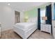 Bedroom featuring an ensuite bathroom, side tables, and nautical accents at 2938 Salted Rim Rd, Kissimmee, FL 34747
