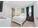 Bedroom with neutral paint, white door, and bright natural light at 2938 Salted Rim Rd, Kissimmee, FL 34747