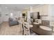 Open concept living and dining area flowing into a kitchen with stainless steel appliances at 2938 Salted Rim Rd, Kissimmee, FL 34747