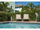 Enjoy outdoor relaxation with cozy lounge chairs surrounding the refreshing pool at 2938 Salted Rim Rd, Kissimmee, FL 34747