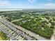 Aerial view of homes near a conservation area and a pond at 3084 Slough Creek Dr, Kissimmee, FL 34744