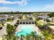 Aerial view of community pool, playground, cabana and nearby houses at 3084 Slough Creek Dr, Kissimmee, FL 34744