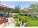 Spacious backyard with a patio, play set, lush greenery, and a privacy fence at 3084 Slough Creek Dr, Kissimmee, FL 34744