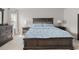 Well-lit bedroom featuring a large bed, matching nightstands, and classic furniture at 3084 Slough Creek Dr, Kissimmee, FL 34744