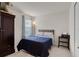 Bedroom with a bed, dark wood armoire, and natural light from a window at 3084 Slough Creek Dr, Kissimmee, FL 34744