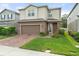 Attractive two-story home featuring brick driveway and well-maintained landscaping at 3084 Slough Creek Dr, Kissimmee, FL 34744