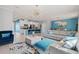 Open-concept living area with modern furnishings, kitchen, and dining space, designed for comfortable living at 3084 Slough Creek Dr, Kissimmee, FL 34744