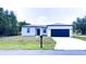 Charming single story home with a large two car garage and neatly manicured lawn at 318 Cocoa Ct, Kissimmee, FL 34758