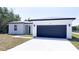 Well-maintained single-story home with a clean, modern exterior and attached two car garage at 318 Cocoa Ct, Kissimmee, FL 34758