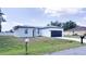 Inviting single story home with a two car garage and front yard at 318 Cocoa Ct, Kissimmee, FL 34758