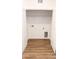 A bright laundry closet space with connections and storage shelving at 318 Cocoa Ct, Kissimmee, FL 34758
