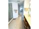 Bathroom featuring tile flooring, shower with glass door, vanity, and walk-in closet at 3341 Pawleys N Loop, St Cloud, FL 34769
