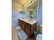 Bright bathroom features a double sink vanity with a large mirror and cabinet storage at 3341 Pawleys N Loop, St Cloud, FL 34769