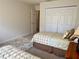 Bright bedroom features two twin beds, a closet, and a floral rug at 3341 Pawleys N Loop, St Cloud, FL 34769