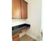Small desk area with granite counters, wood cabinets, and natural light at 3341 Pawleys N Loop, St Cloud, FL 34769