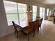Bright dining area with chandelier and view of the pool area at 3341 Pawleys N Loop, St Cloud, FL 34769