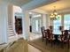 Inviting foyer with staircase and dining room views at 3341 Pawleys N Loop, St Cloud, FL 34769