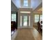 Bright foyer featuring a decorative front door, tile flooring, and views into other living spaces at 3341 Pawleys N Loop, St Cloud, FL 34769