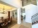 Grand foyer with high ceilings, staircase, and views into the dining and living rooms at 3341 Pawleys N Loop, St Cloud, FL 34769