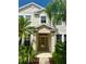 Elegant front entrance with a decorative glass door and tasteful landscaping at 3341 Pawleys N Loop, St Cloud, FL 34769