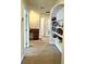 Bright hallway with built-in shelving and a small desk area at 3341 Pawleys N Loop, St Cloud, FL 34769