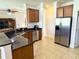 Kitchen area with stainless steel appliances, granite counters, and tile floors at 3341 Pawleys N Loop, St Cloud, FL 34769