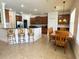 Open kitchen features a breakfast bar and dining area, perfect for casual dining at 3341 Pawleys N Loop, St Cloud, FL 34769
