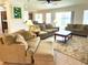 Spacious living room with tile floors and open layout at 3341 Pawleys N Loop, St Cloud, FL 34769