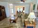 Inviting living room with open floor plan and view into the dining area at 3341 Pawleys N Loop, St Cloud, FL 34769