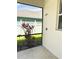 Outdoor shower area featuring a plant, screened enclosure, and a view to the backyard at 3341 Pawleys N Loop, St Cloud, FL 34769
