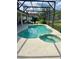 Backyard pool and spa area with a screened enclosure and a view of the home at 3341 Pawleys N Loop, St Cloud, FL 34769