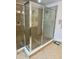 Walk-in tiled shower featuring glass doors and modern fixtures at 3341 Pawleys N Loop, St Cloud, FL 34769
